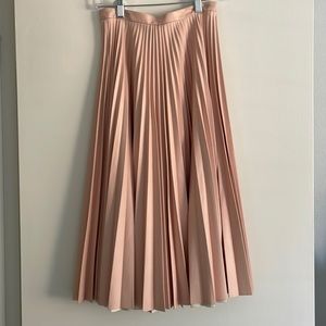 Pink pleated faux leather midi skirt